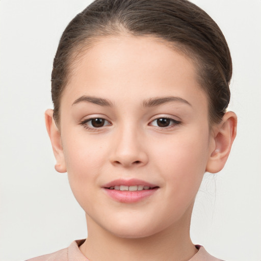 Joyful white child female with short  brown hair and brown eyes