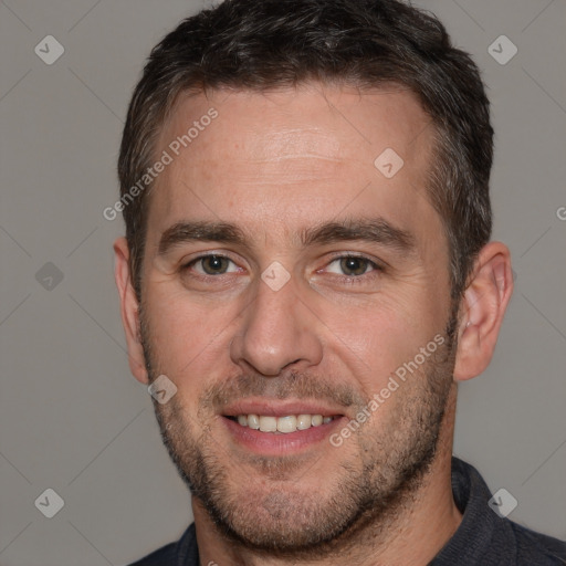 Joyful white adult male with short  brown hair and brown eyes