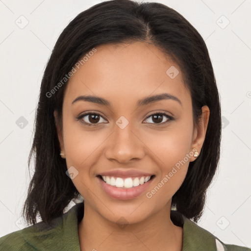 Joyful latino young-adult female with long  brown hair and brown eyes