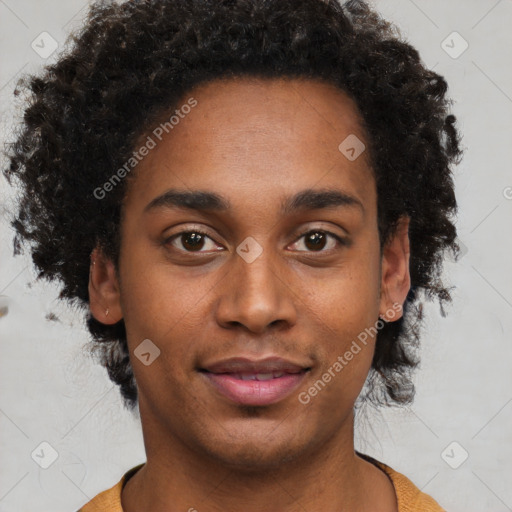 Joyful black young-adult male with short  brown hair and brown eyes