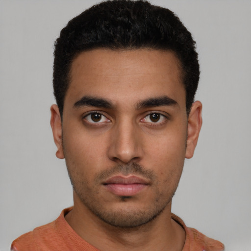Neutral latino young-adult male with short  black hair and brown eyes