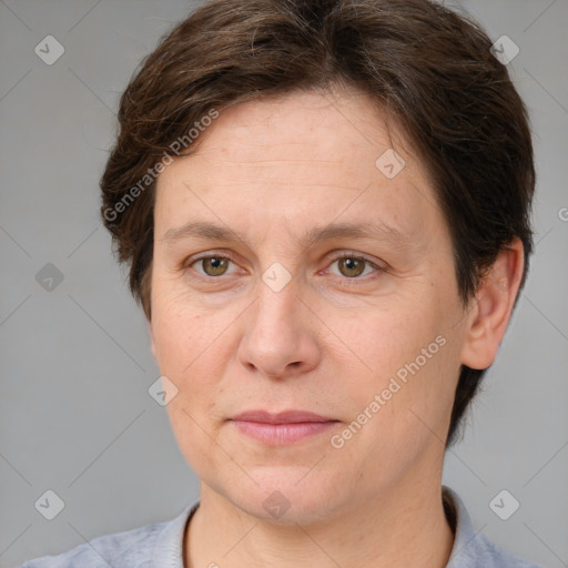 Joyful white adult female with short  brown hair and brown eyes