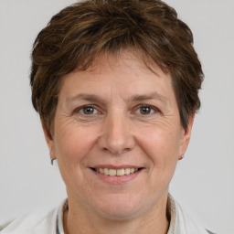 Joyful white adult female with short  brown hair and brown eyes