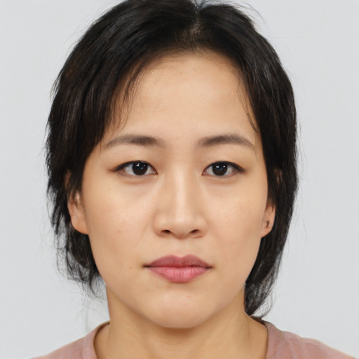 Neutral asian young-adult female with medium  brown hair and brown eyes