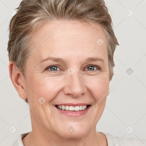 Joyful white adult female with short  brown hair and grey eyes