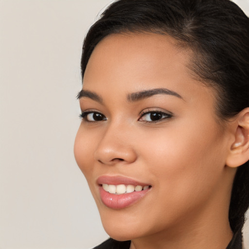 Joyful latino young-adult female with long  brown hair and brown eyes