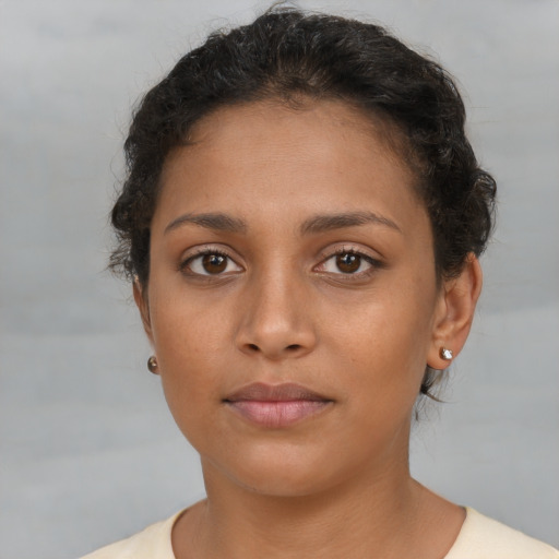 Neutral latino young-adult female with short  brown hair and brown eyes