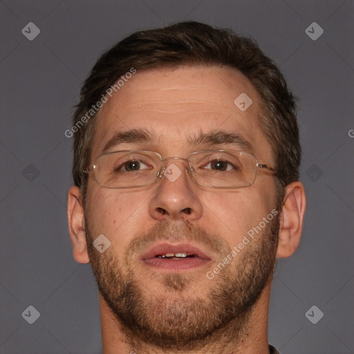 Joyful white adult male with short  brown hair and brown eyes