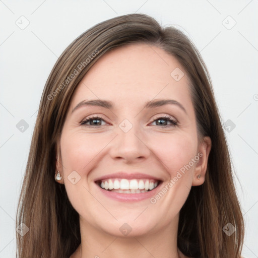 Joyful white young-adult female with long  brown hair and grey eyes