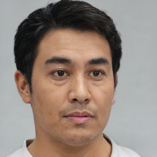 Neutral asian young-adult male with short  brown hair and brown eyes