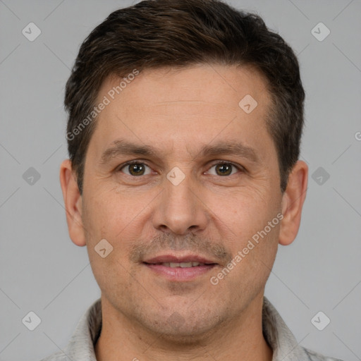 Joyful white adult male with short  brown hair and brown eyes