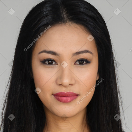 Joyful latino young-adult female with long  brown hair and brown eyes