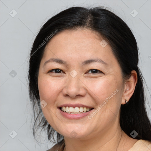 Joyful white adult female with medium  brown hair and brown eyes