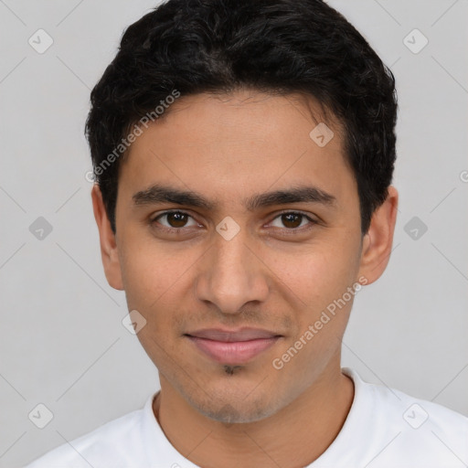 Joyful white young-adult male with short  black hair and brown eyes