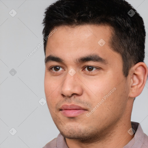 Joyful white young-adult male with short  black hair and brown eyes