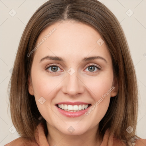 Joyful white young-adult female with medium  brown hair and green eyes