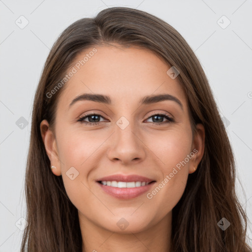 Joyful white young-adult female with long  brown hair and grey eyes