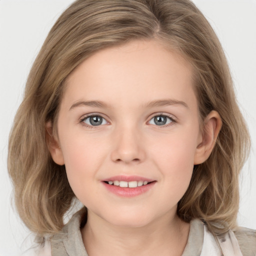 Joyful white child female with medium  brown hair and grey eyes