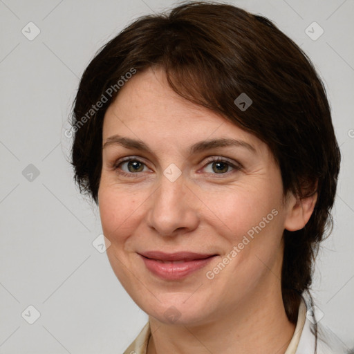 Joyful white adult female with medium  brown hair and grey eyes