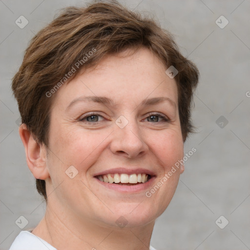 Joyful white adult female with short  brown hair and grey eyes