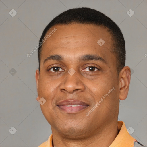 Joyful latino adult male with short  brown hair and brown eyes