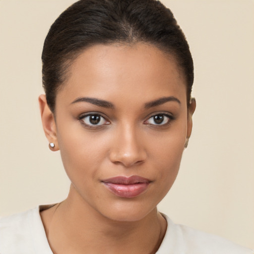 Joyful latino young-adult female with short  brown hair and brown eyes