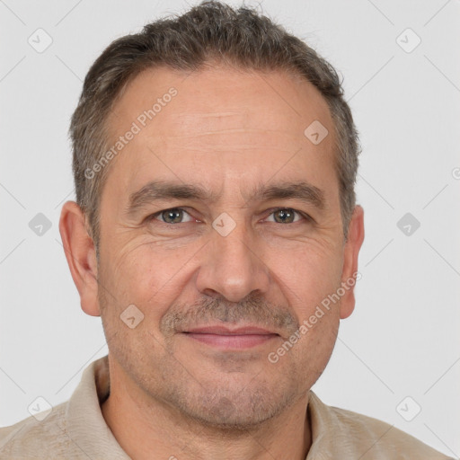 Joyful white adult male with short  brown hair and brown eyes