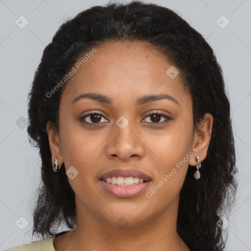 Joyful black young-adult female with long  brown hair and brown eyes