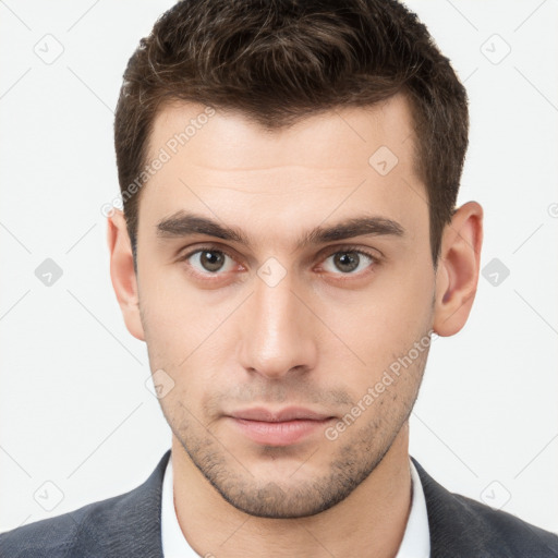 Neutral white young-adult male with short  brown hair and brown eyes