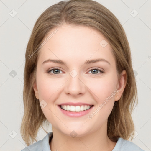 Joyful white young-adult female with medium  brown hair and blue eyes