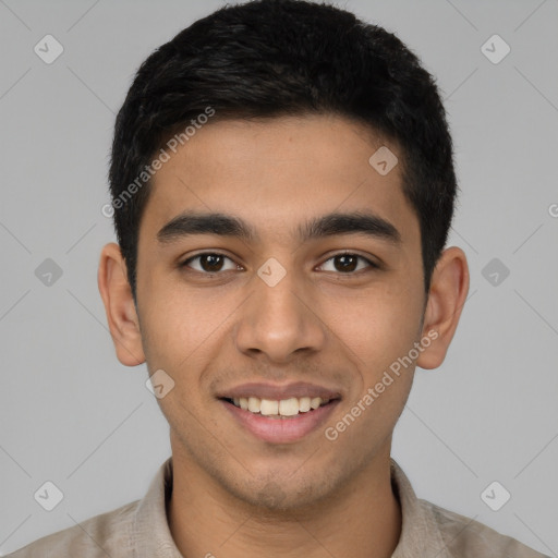 Joyful latino young-adult male with short  brown hair and brown eyes