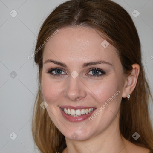 Joyful white young-adult female with long  brown hair and grey eyes