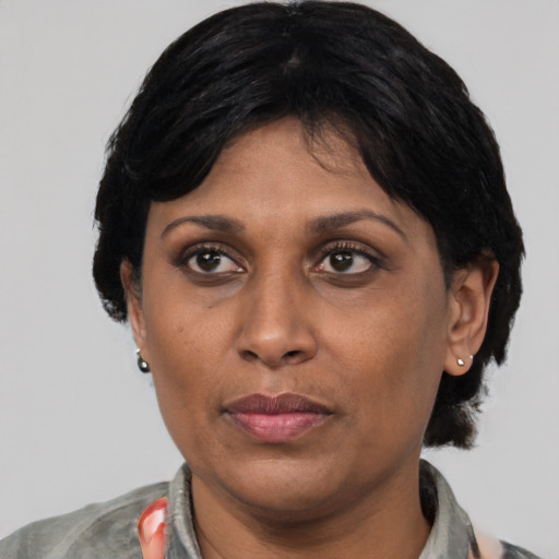 Joyful asian adult female with short  black hair and brown eyes