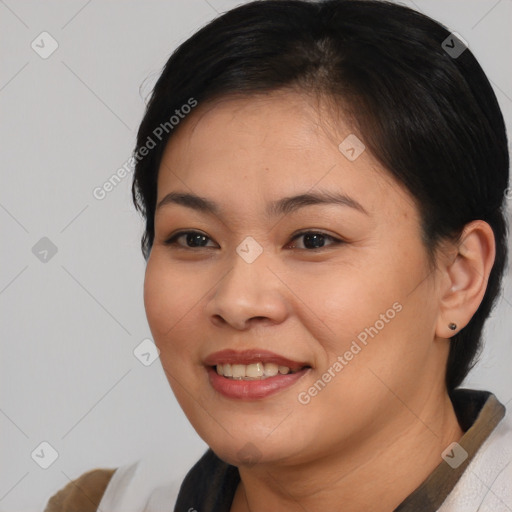 Joyful asian young-adult female with short  brown hair and brown eyes