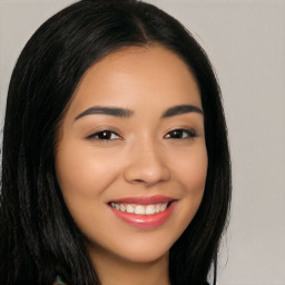 Joyful latino young-adult female with long  black hair and brown eyes