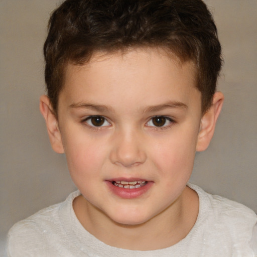 Joyful white child male with short  brown hair and brown eyes