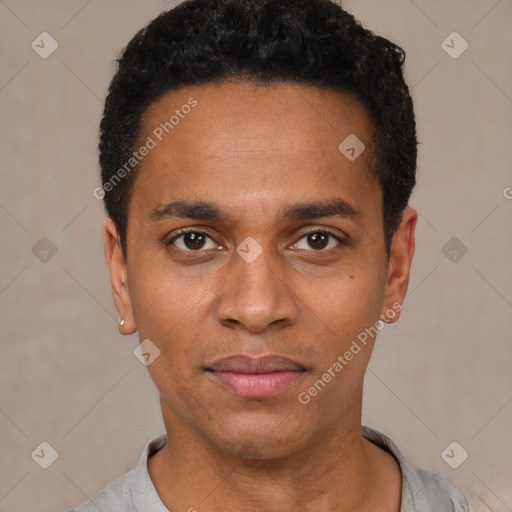 Joyful black young-adult male with short  black hair and brown eyes