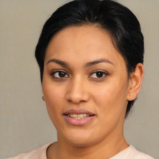 Joyful asian young-adult female with short  brown hair and brown eyes