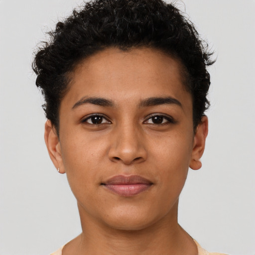 Joyful latino young-adult female with short  brown hair and brown eyes