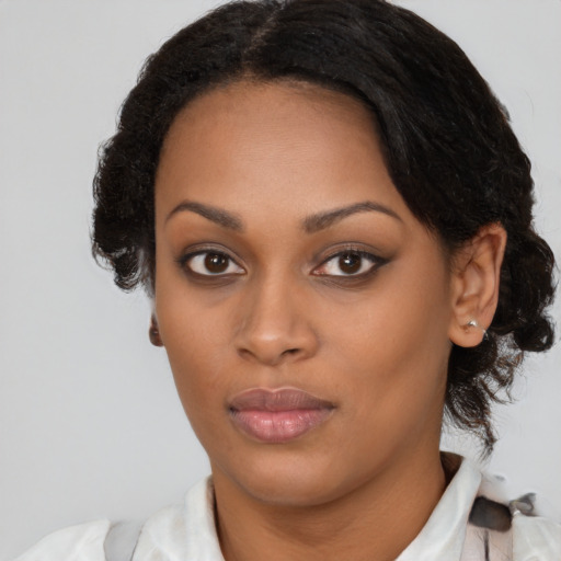 Neutral black young-adult female with medium  brown hair and brown eyes