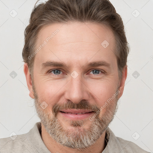 Joyful white adult male with short  brown hair and grey eyes