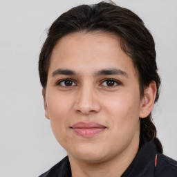 Joyful white young-adult male with medium  brown hair and brown eyes