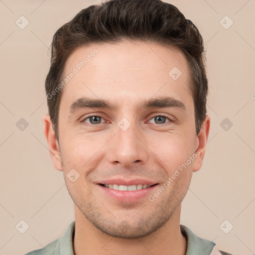 Joyful white young-adult male with short  brown hair and brown eyes