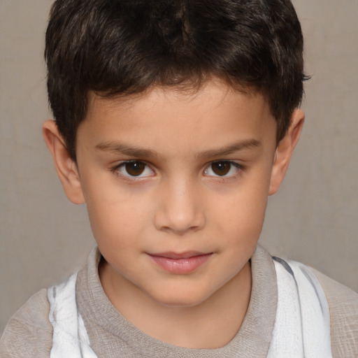 Joyful white child male with short  brown hair and brown eyes