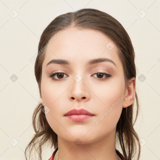 Neutral white young-adult female with long  brown hair and brown eyes