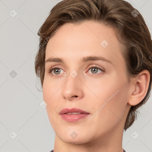 Joyful white young-adult female with medium  brown hair and green eyes