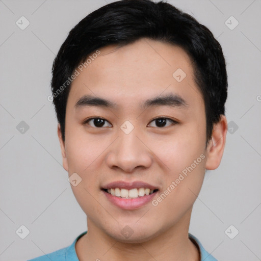 Joyful asian young-adult male with short  black hair and brown eyes