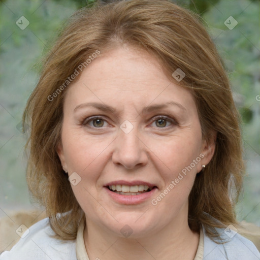 Joyful white adult female with medium  brown hair and brown eyes