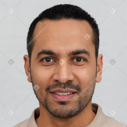 Joyful white young-adult male with short  black hair and brown eyes