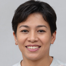 Joyful asian young-adult female with short  brown hair and brown eyes